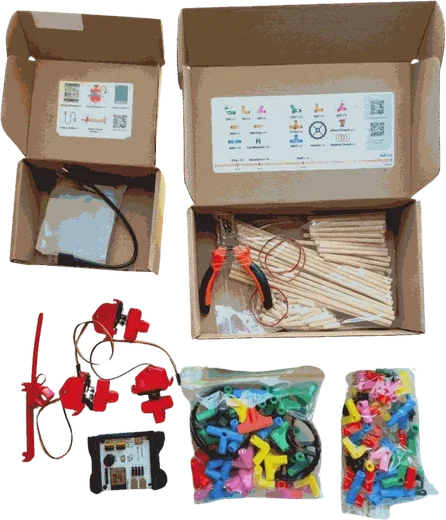 A Stick ’Em individual robotics kit with its box, board, motors, chopsticks and connectors
