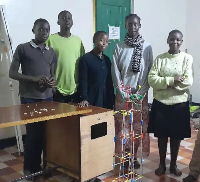 Students in Uganda with a chopstick build